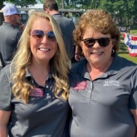 A picture of two women at the Shareholder's picnic.