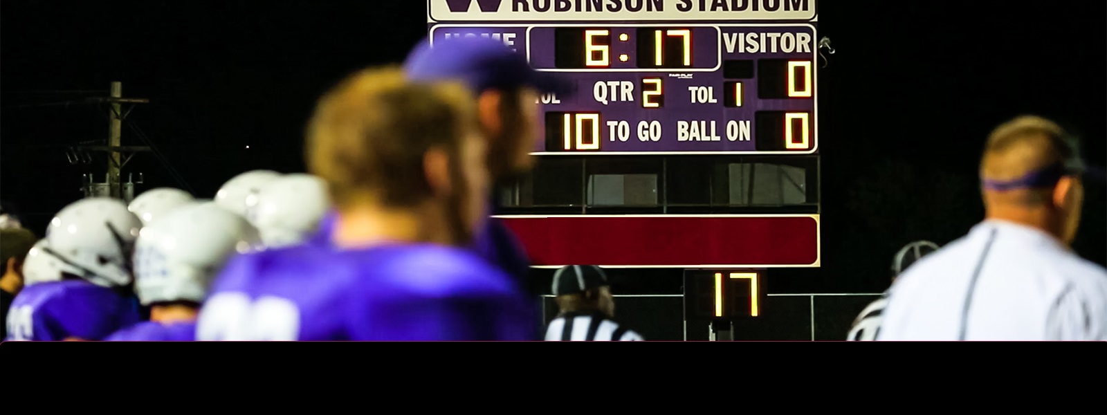 A high school football score board with Swift Trust Revolution logo.