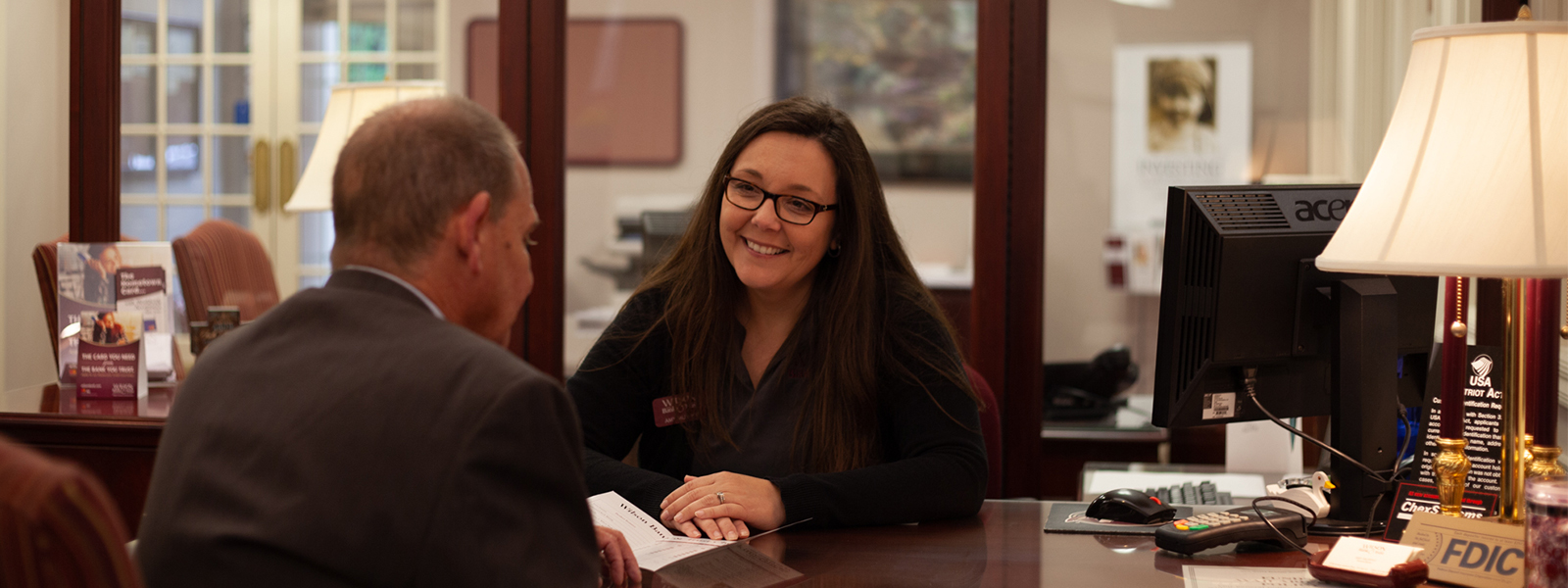 Female banker helping a customer.