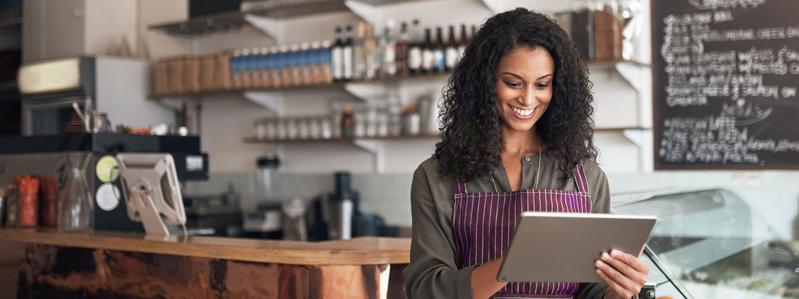 Business woman using tablet in shop