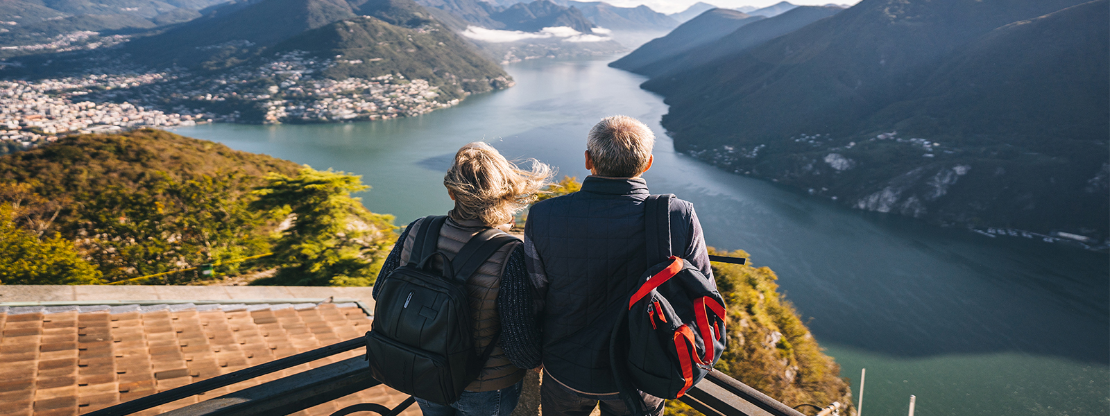 A couple enjoys the view of mountains in the distance