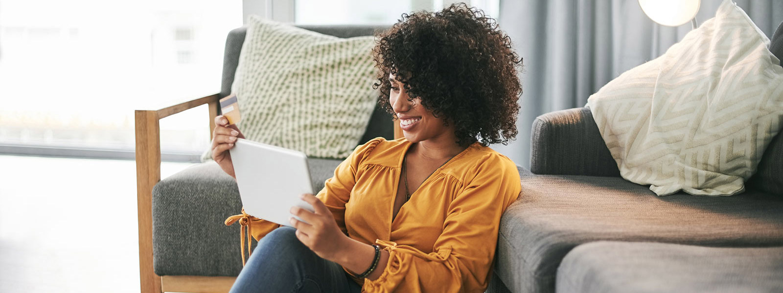 Woman using tablet in living room