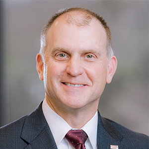 A headshot of John McDearman III, the CEO of Swift Trust Revolution.